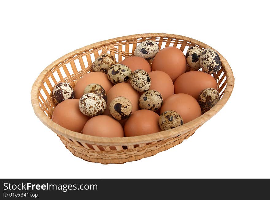 Differents  eggs in the basket isolated on a white background. Differents  eggs in the basket isolated on a white background.