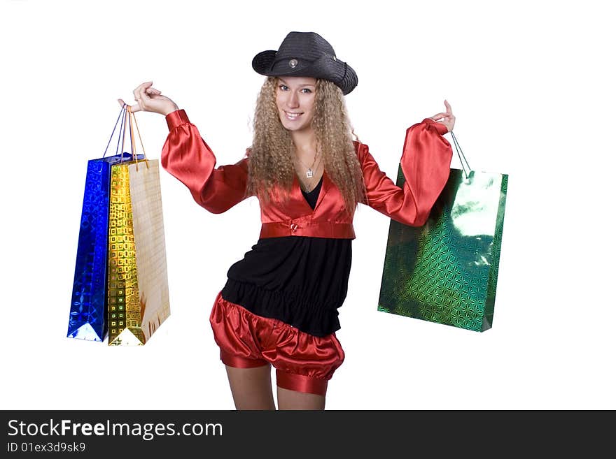 The young beautiful girl with purchases in colour packages during shopping on a white background