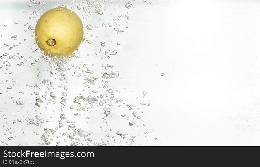 Citrus is dropped into  water.