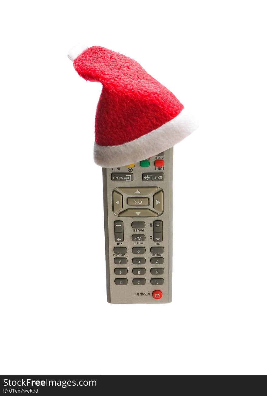 Remote control in a Christmas hat isolated