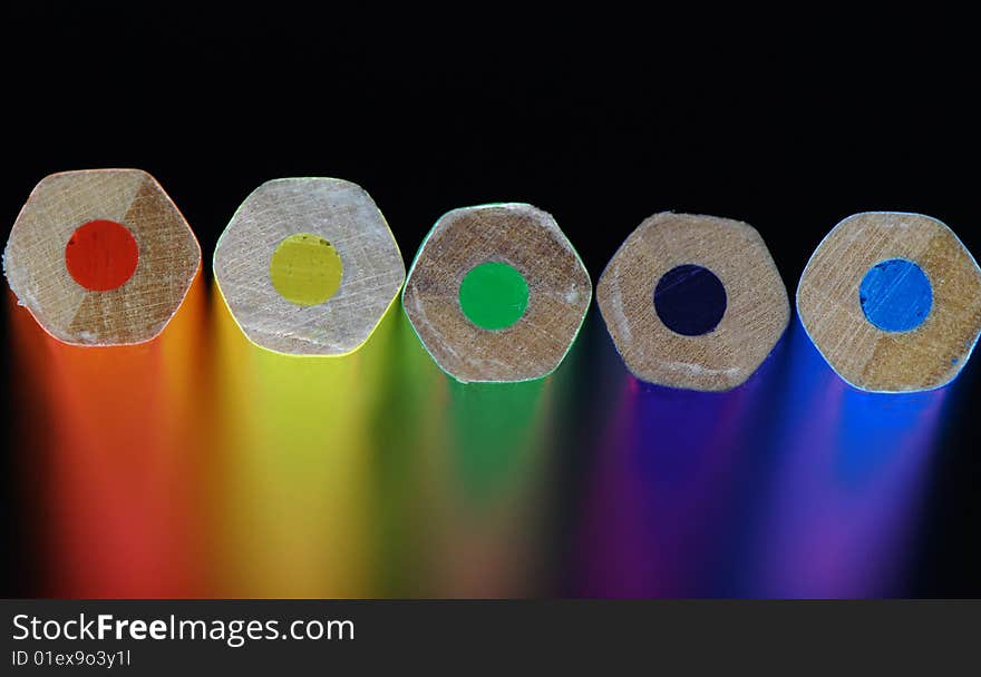 Five color pencils. The back background is washed away. Five color pencils. The back background is washed away