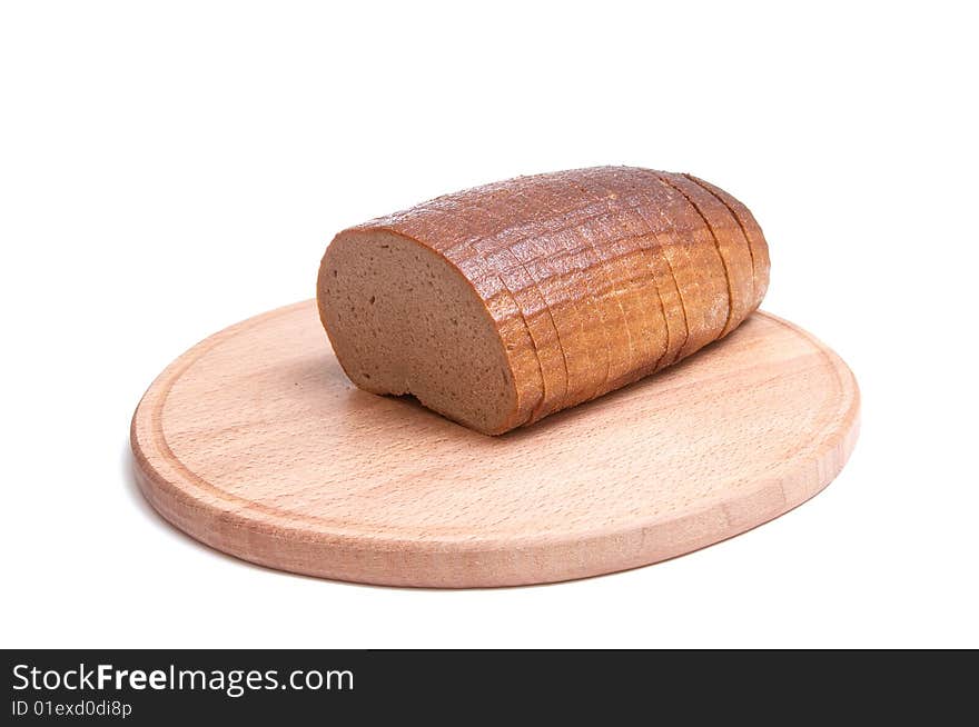 Long loaf and round board isolated on a white background. Long loaf and round board isolated on a white background.