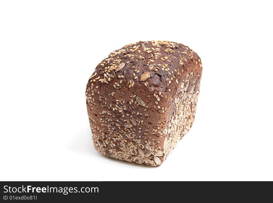 Loaf of bread full of seeds isolated on a white background. Loaf of bread full of seeds isolated on a white background.