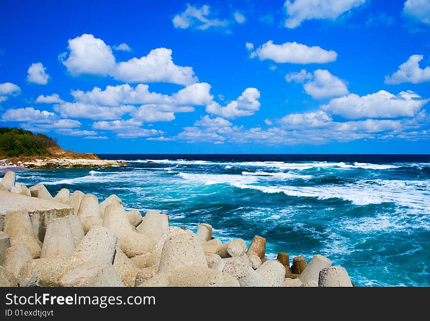 Cloudy blue sky and sea waves