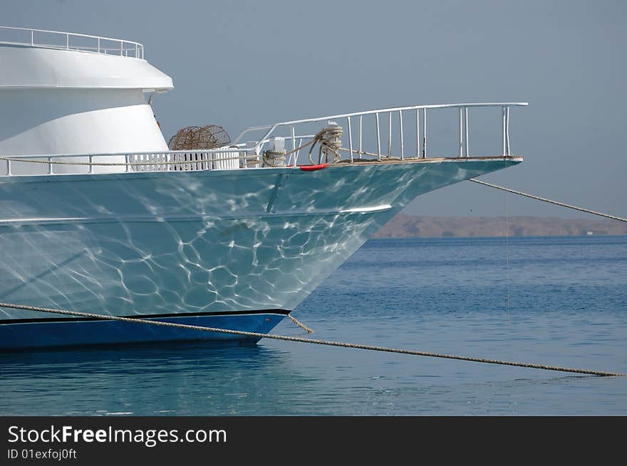 Docked boat in sea port, read sea