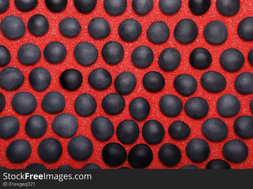 Background from black stones on red sand. Background from black stones on red sand