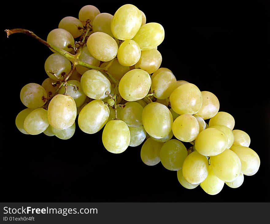 Bunch of grapes on black.