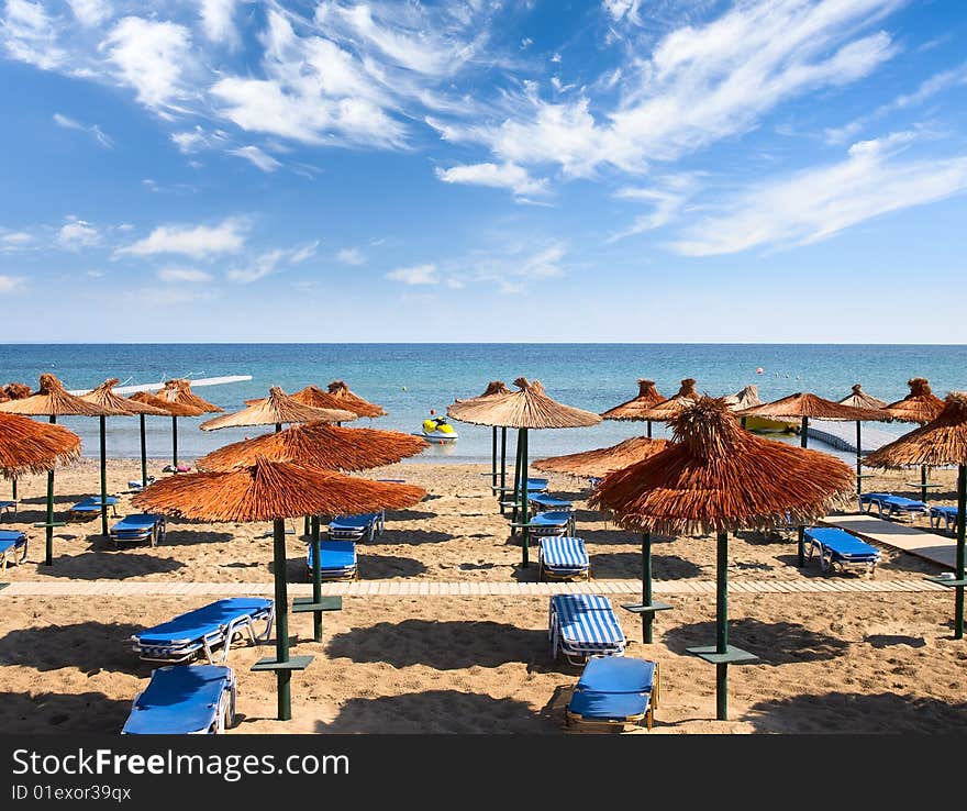 Beach with sunshades and  beds