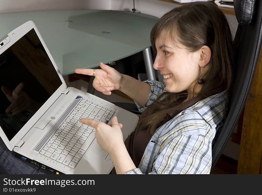 Young woman looks at her notebook