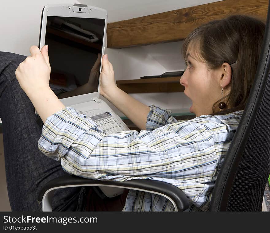 Young woman looks at her notebook