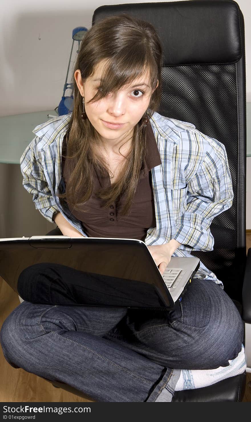 Young Woman Looks At Her Notebook