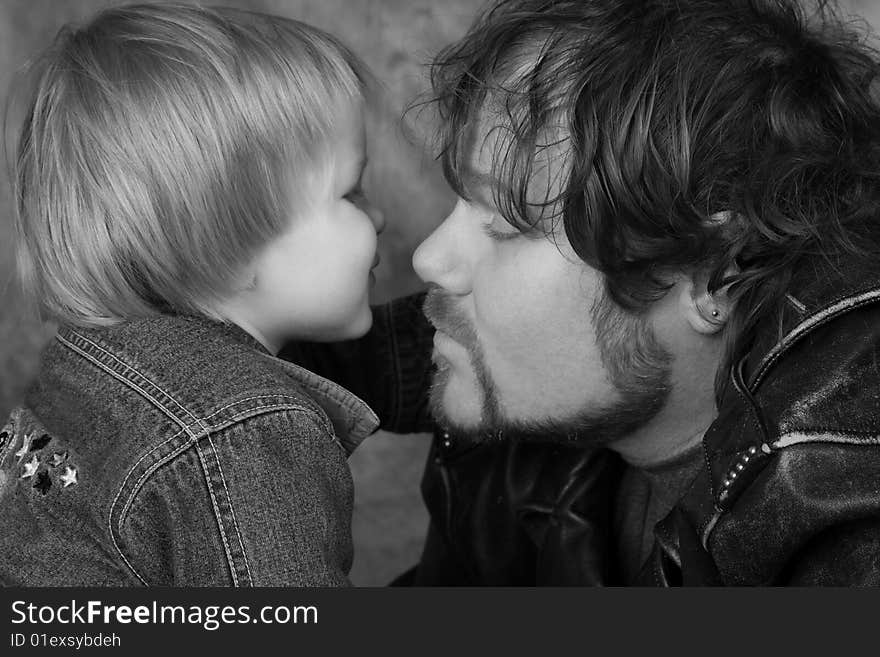 Son kissing Daddy Biker Jackets on, Black and White. Son kissing Daddy Biker Jackets on, Black and White