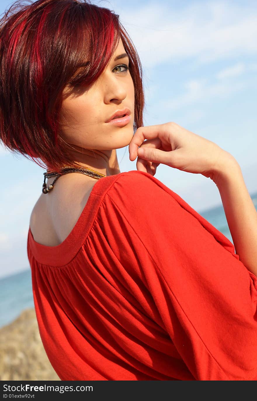 Young Woman On A Blue Sky