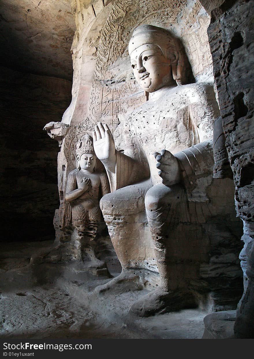 Yungang grottoes, Shanxi, China. Interior shot of one of the large statues. Yungang grottoes, Shanxi, China. Interior shot of one of the large statues.