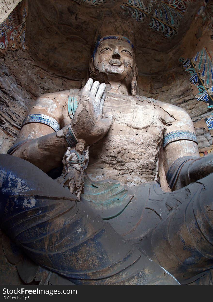 Yungang grottoes, Shanxi, China. Interior shot of one of the large statues. Yungang grottoes, Shanxi, China. Interior shot of one of the large statues.