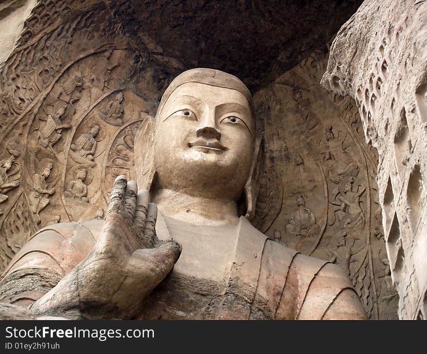 Yungang grottoes, Datong, China. Exterior view of the statues. Detail. Yungang grottoes, Datong, China. Exterior view of the statues. Detail.