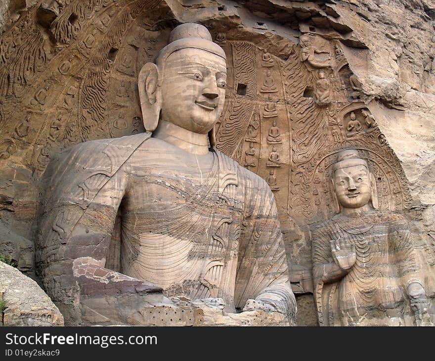 Yungang grottoes, Datong, China. Exterior view of the statues. Yungang grottoes, Datong, China. Exterior view of the statues.