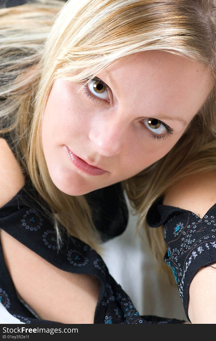 Closeup of a gorgeous blond woman looking up at the camera. Closeup of a gorgeous blond woman looking up at the camera