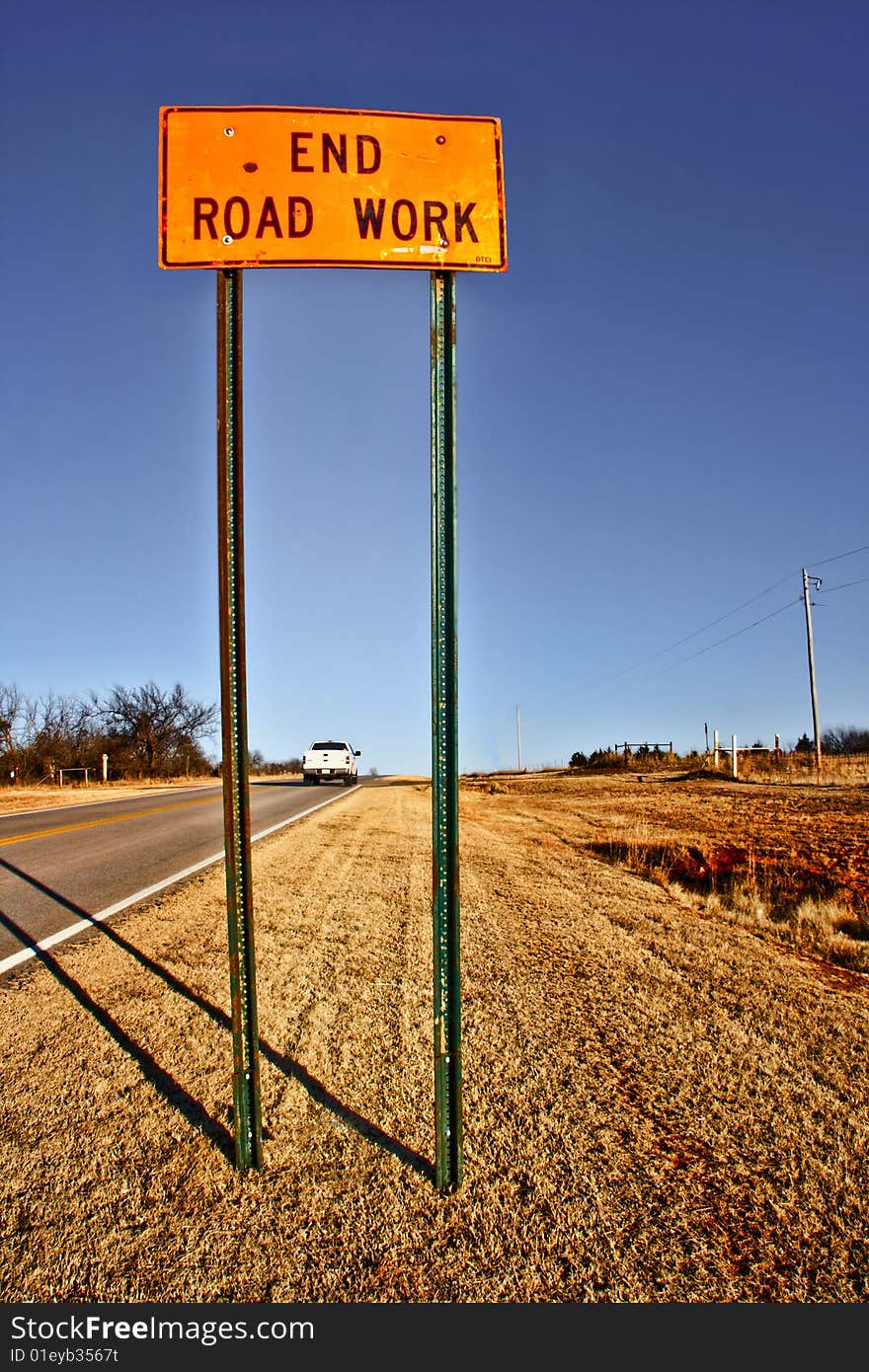 Sign marking the end of road construction. Sign marking the end of road construction