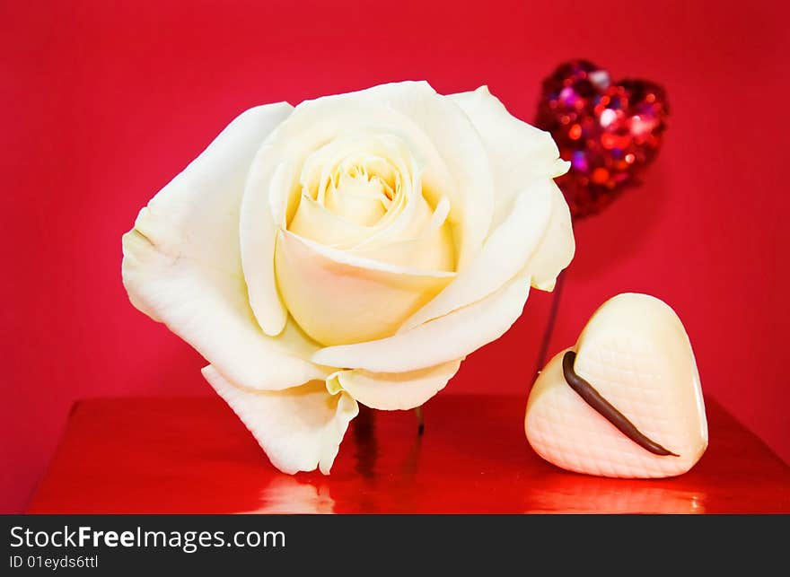 Passionate love - white rose and glowing hearts