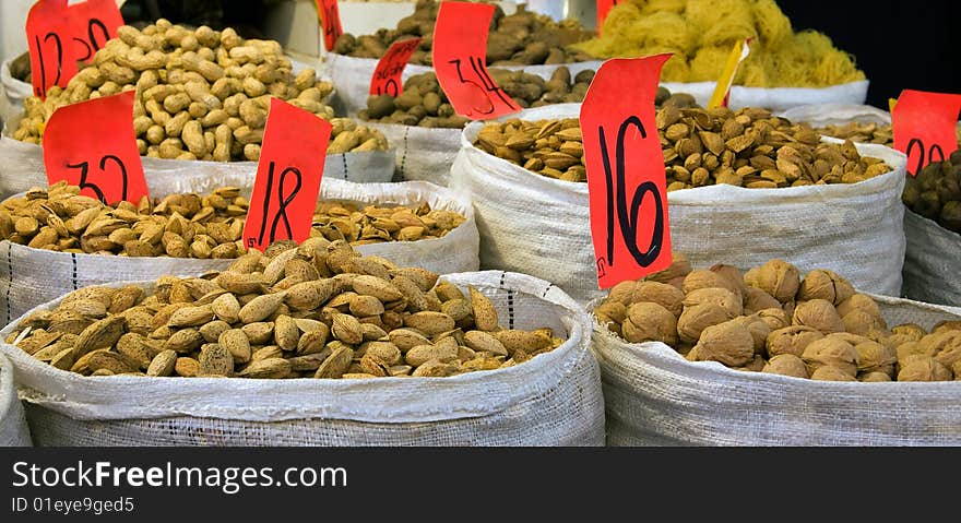 Heaps of nuts and almonds in a marketing stand