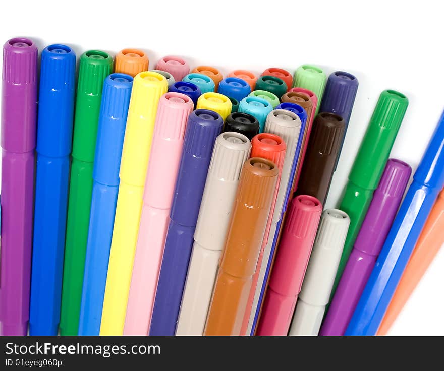 Many closed felt-tip pens, pastel and dark colors