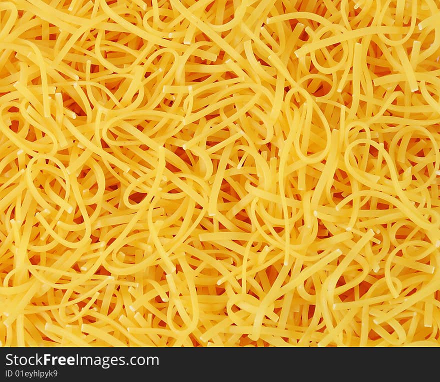 Background of bright yellow nuddles. Background of bright yellow nuddles