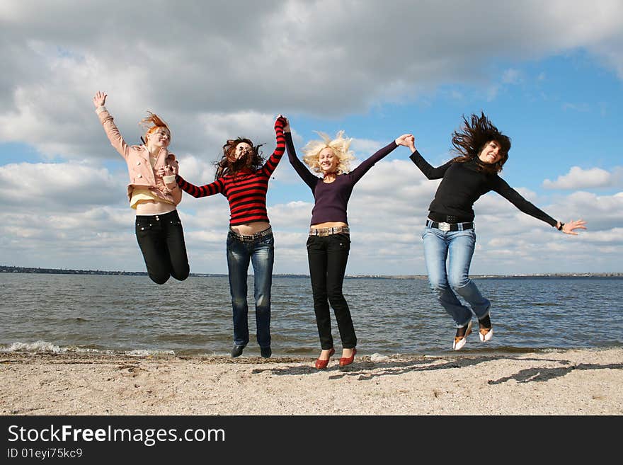 Girls jumping up at the beach. Girls jumping up at the beach