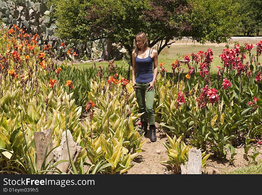 Beautiful girl enjoying the sunny weather in the garden