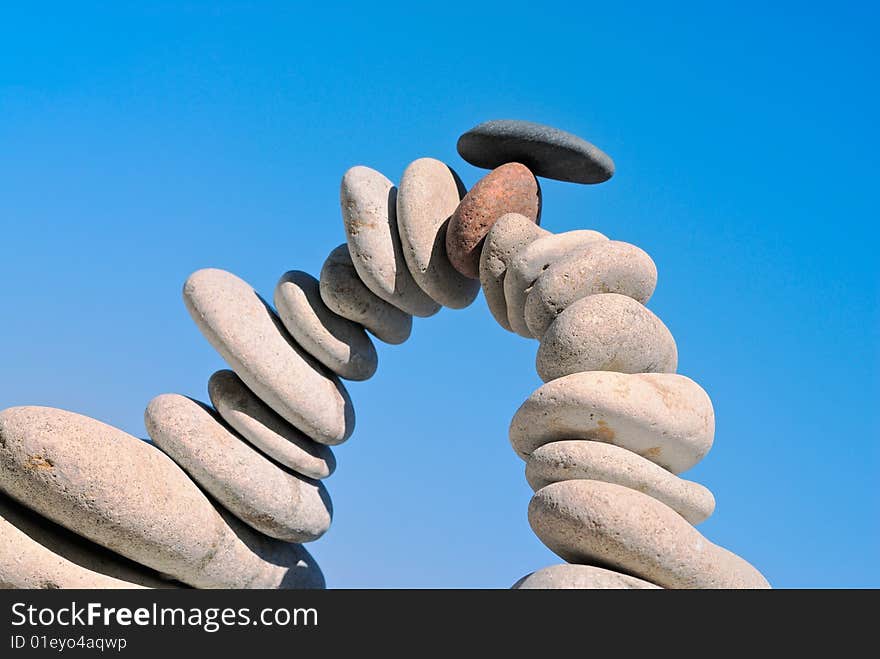 Arch from a sea pebble against the pure sky. Arch from a sea pebble against the pure sky