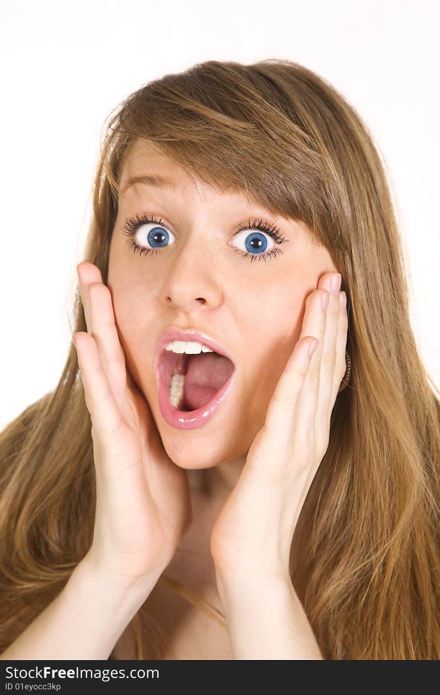 Portrait of a beautiful Caucasian woman holding her face in astonishment. Isolated over white