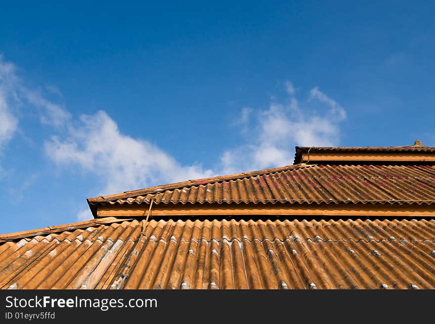 A three tiered high roof in a old colonial building designed for the humid hot tropical climate