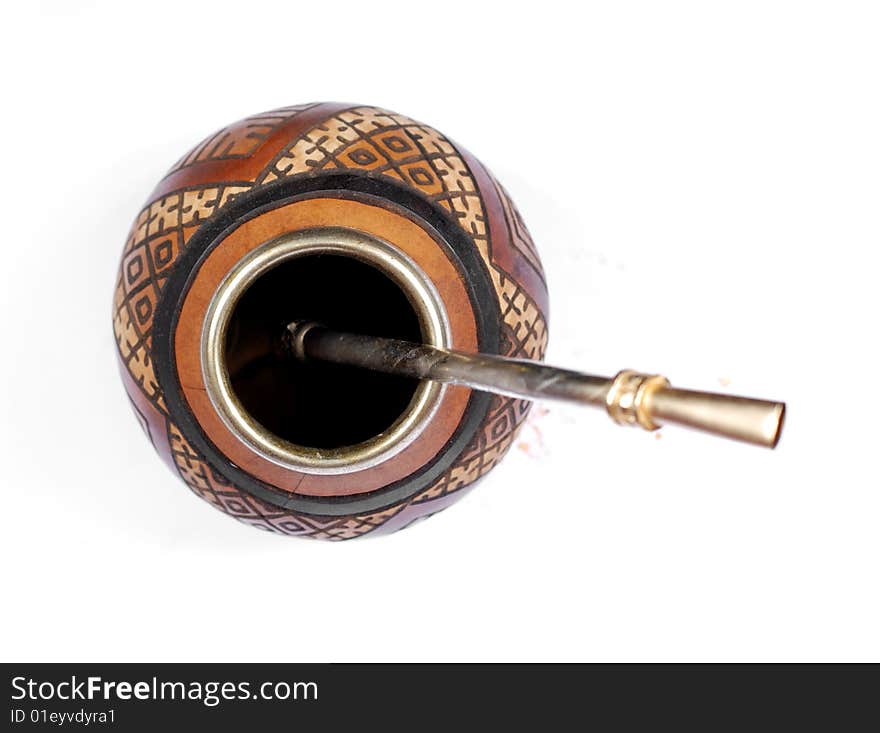 Calabash with ethnic ornament and metal straw. Calabash with ethnic ornament and metal straw