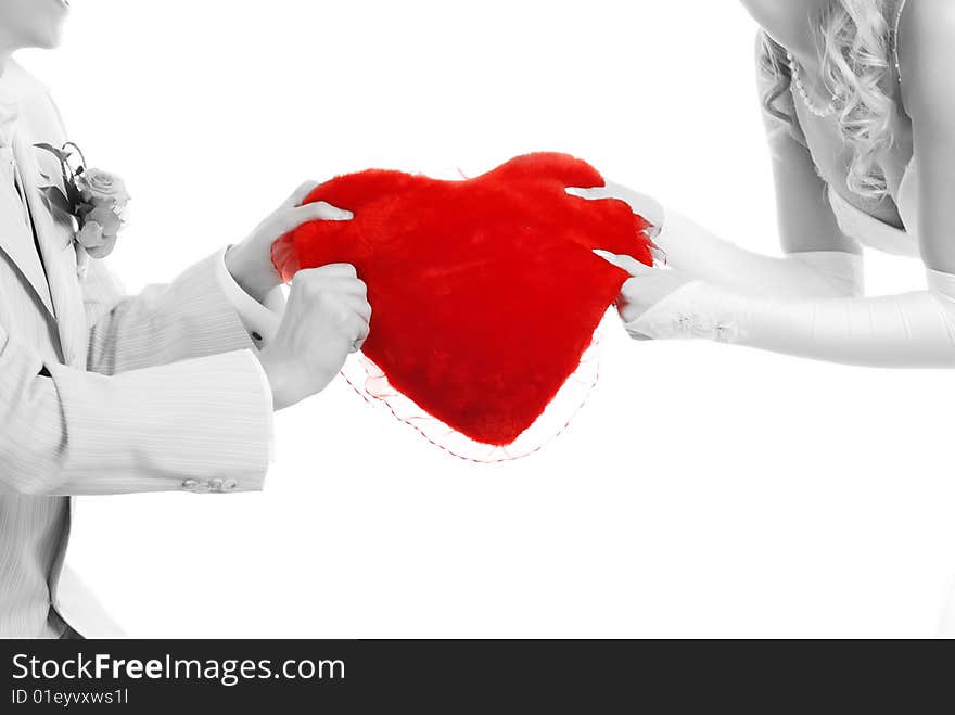 Picture of loving couple with red heart in their hands