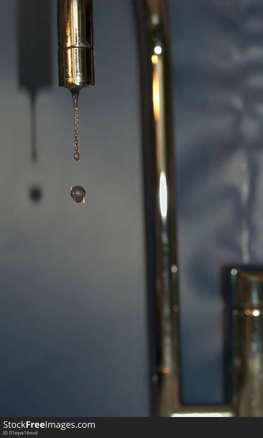 Water drops and spigot in kitchen