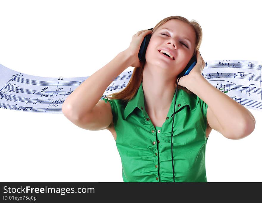 Young beautiful woman listening music with headpfones. Young beautiful woman listening music with headpfones