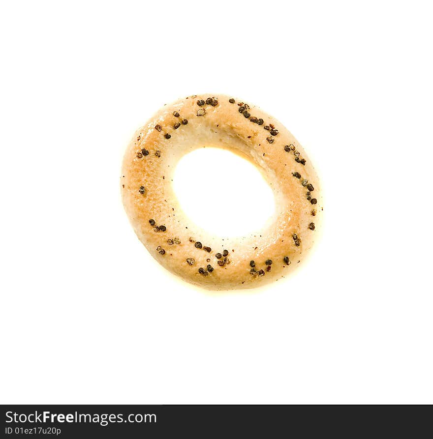 Ring biscuit with poppyseed on white ground