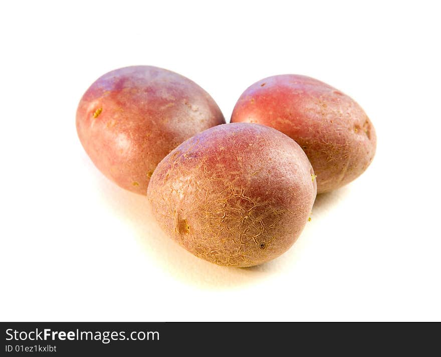 Tree potatoes on white ground