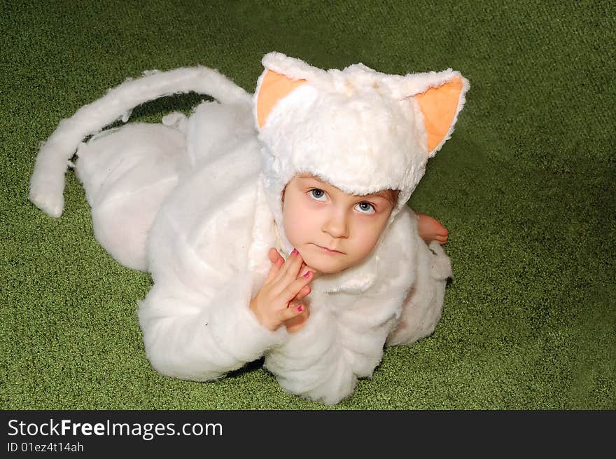 Little girl wearing a white kitten costume. Little girl wearing a white kitten costume