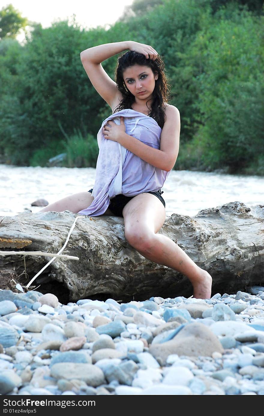 The beautiful girl on a background of the river