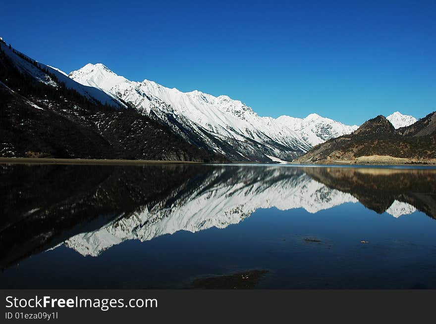 Snow Mountains and Lake