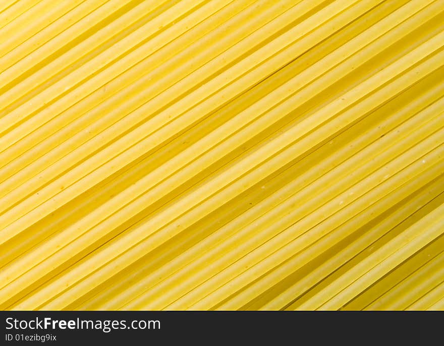 A close-up of a lot of raw spaghetti