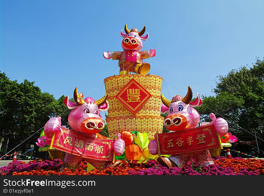 Three cute lanterns bulls in front of the park, it is Chinese New Year decorations. Three cute lanterns bulls in front of the park, it is Chinese New Year decorations