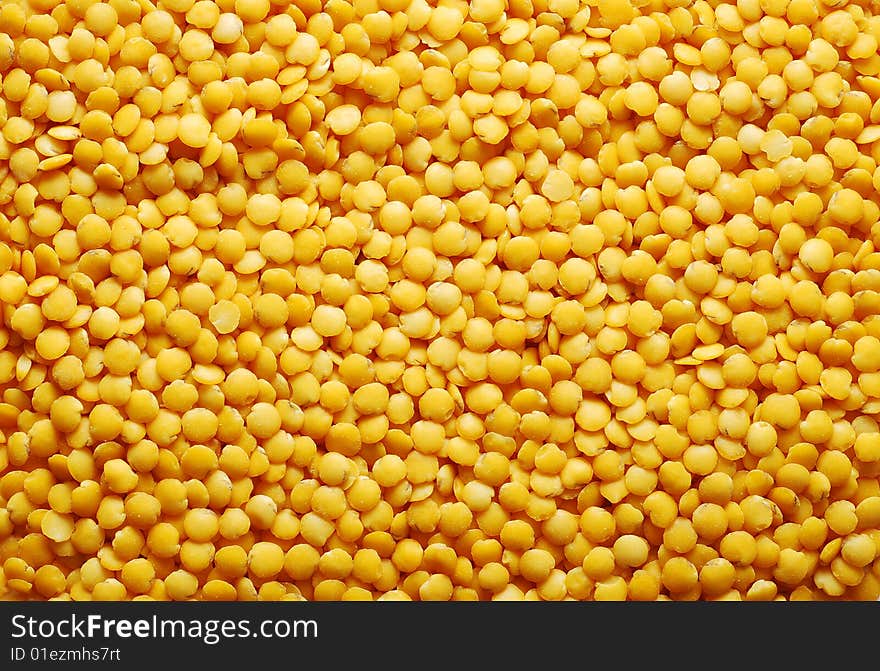 Yellow lentil background. food background