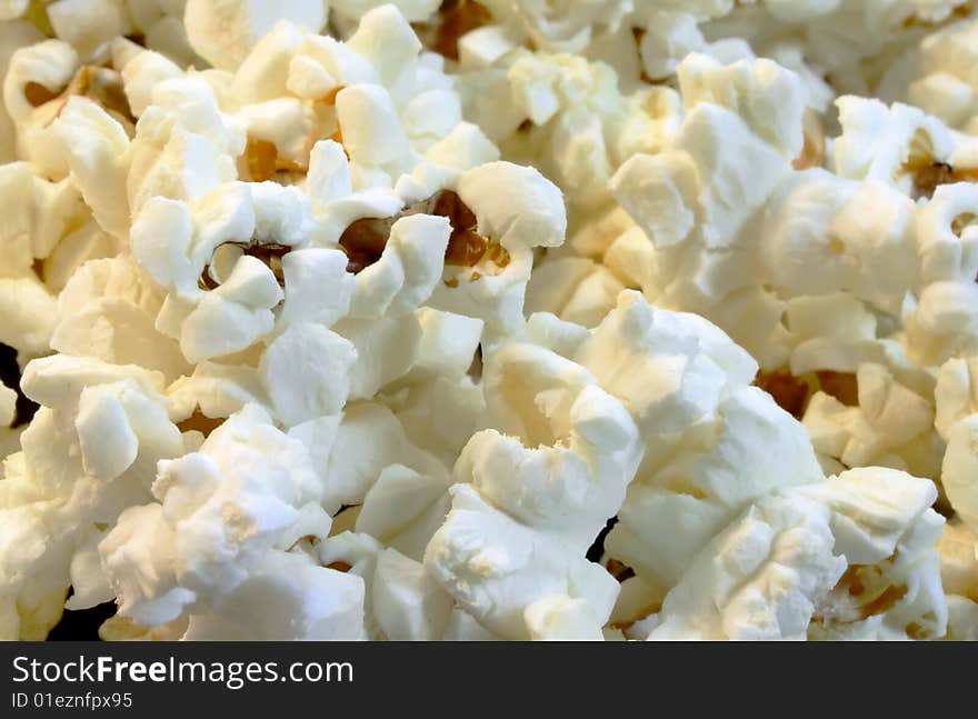 Scattered flakes of salty popcorn. Photo close-up