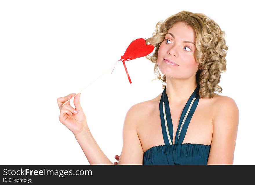 Young blond holding a red heart. Isolated over white.