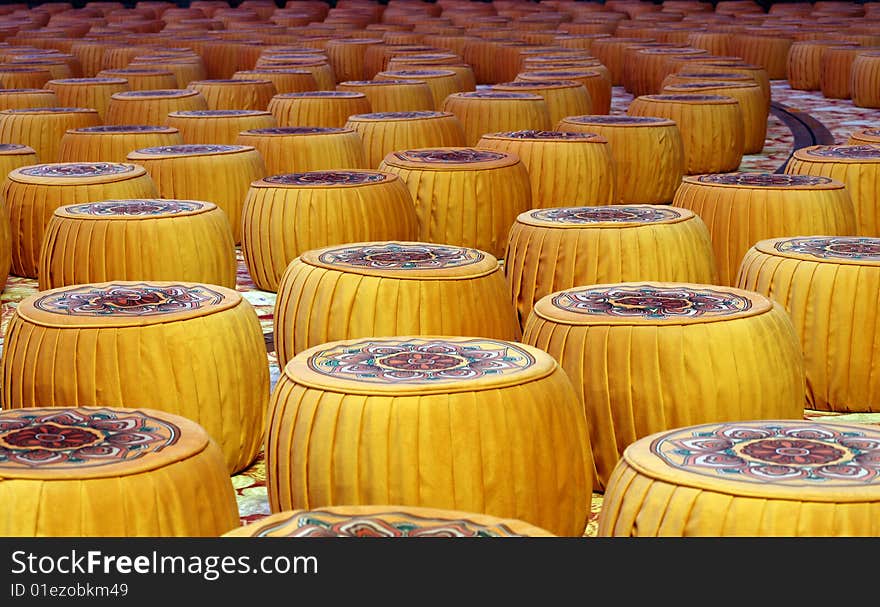 Golden drums arraged in a hall as seats