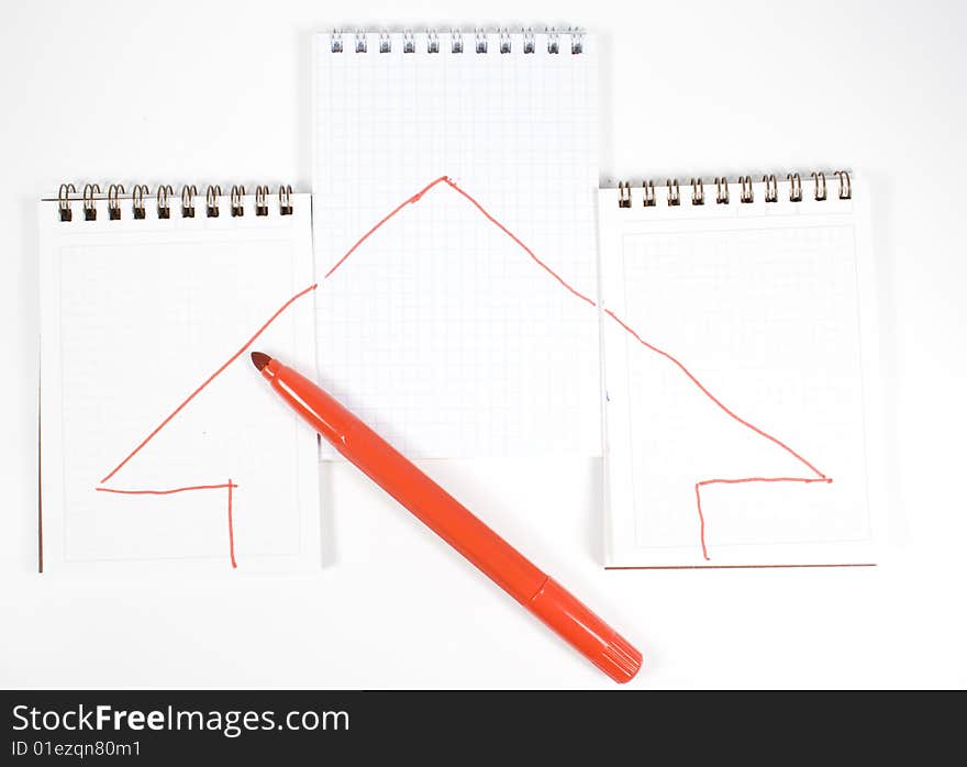 Three open notebooks with arrows and red felt-tip pen. Three open notebooks with arrows and red felt-tip pen