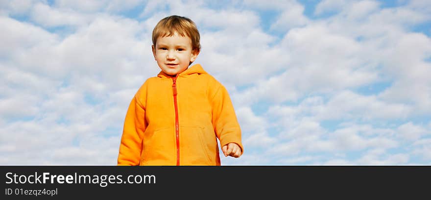 Happy boy on sky background