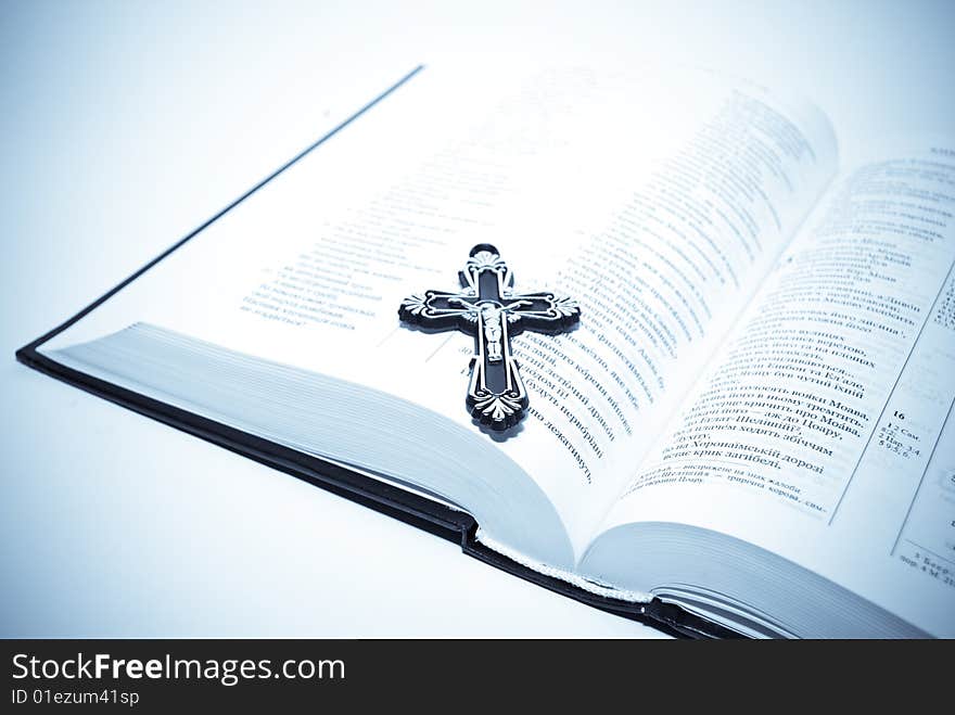 Religion concept.Book and cross